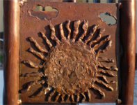Bronzeplatte Sonne